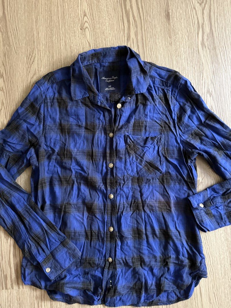 American Eagle Outfitters Plaid Shirt (Category: Tshirts & Polo Shirts ) located in Pasig City. Submitted by anjeg (Listing ID 1437406972, Image 1). Description: - American Eagle Outfitters plaid shirt - Color: Blue and black - Size: S/P - Features: Button-down front, single chest pocket, long sleeves with buttoned cuffs - Classic collar - Made in Indonesia.