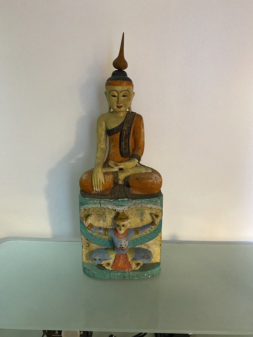 Antique Wooden Buddha Statue (Category: Other Home Decor) located in Manila. Submitted by hcrowe194878225 (Listing ID 1437402666, Image 2). Description: - Exquisite wooden Buddha statue - Intricate details and vibrant colors - Includes an elongated spire on the head - A unique art piece.