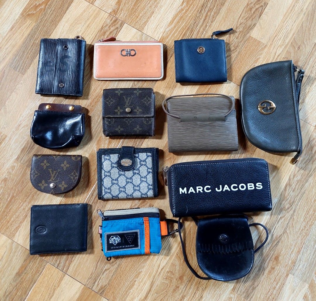 Assorted Wallets - Gucci, Marc Jacobs, Porter (Category: Luxury Bags & Wallets) located in Puerto Princesa. Submitted by YeSurJOMS (Listing ID 1437430900, Image 1). Description: Collection of various wallets, including brands like Gucci, Marc Jacobs, and Porter. Features different styles, colors, and sizes. Some wallets have visible logos and designs. Includes a variety of materials and closures. Perfect for organizing your essentials..