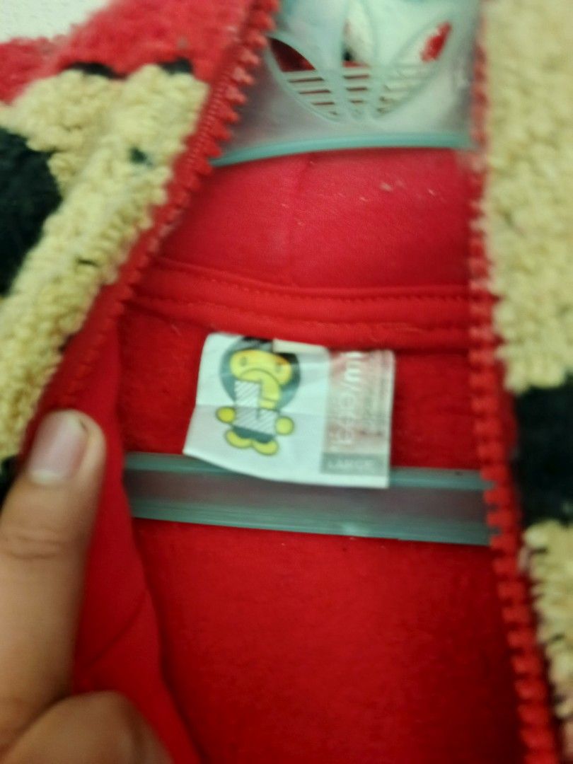 Baby Milo Mario Hoodie (Category: Hoodies) located in Bolinao. Submitted by willaskyle19427 (Listing ID 1437420918, Image 3). Description: - Red hoodie with a large Mario design on the front. - Features a Baby Milo Mario graphic on the back. - Full zip closure. - Hood designed like a Mario hat. - Made of soft material. - Includes a kangaroo pocket. issue - not working zipper need repair.