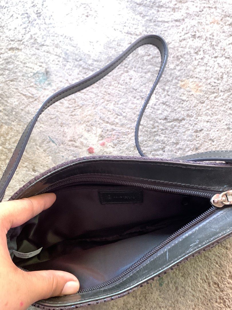 Balmain Shoulder Bag (Category: Luxury Bags & Wallets) located in Manila. Submitted by t.nicole_revilla (Listing ID 1437438513, Image 3). Description: - Balmain shoulder bag - Dark purple color - Zipper closure - Small handle - Interior pocket - Textured exterior - Gold-colored hardware - Ideal for everyday use.