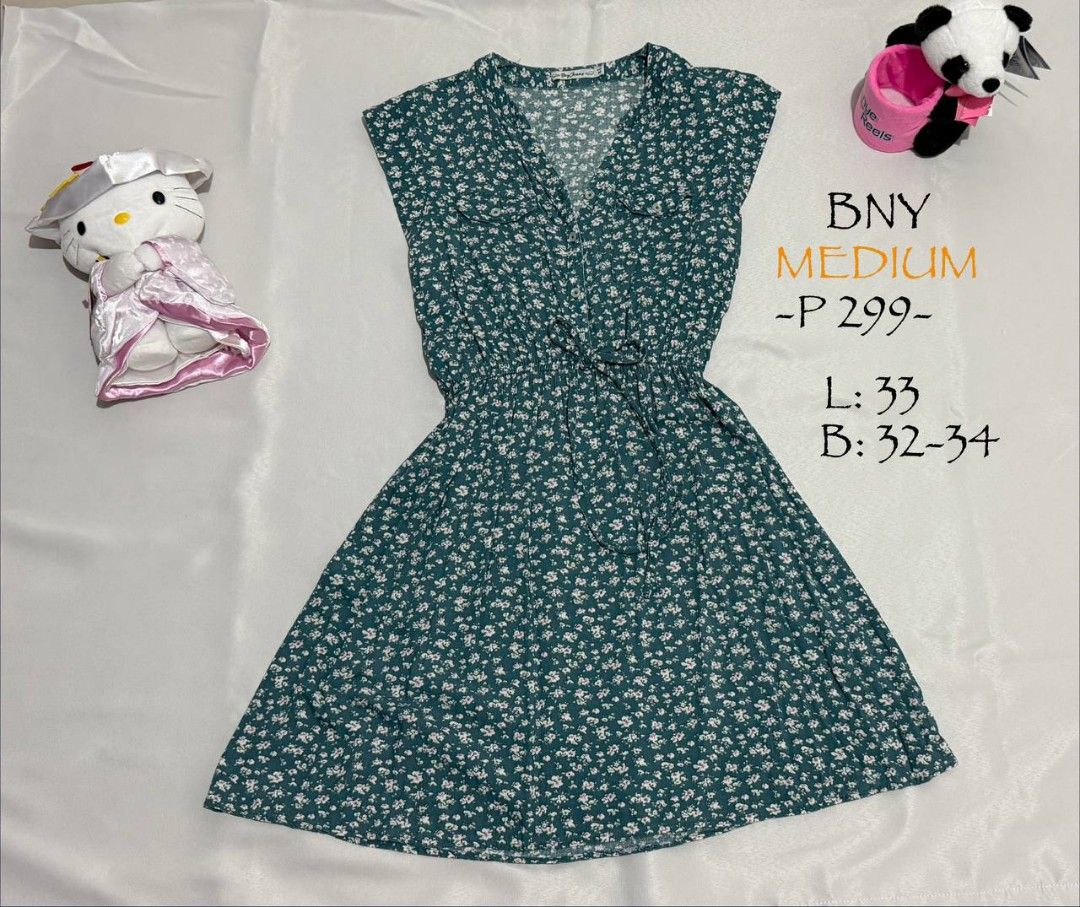 BNY Floral Dress - Medium (Category: Dresses) located in Alaminos. Submitted by declutteritems2024 (Listing ID 1437559651, Image 1). Description: BNY floral dress in medium size. Features a V-neck design and a cinched waist. The dress has a green base with small white floral patterns. Measurements are L: 33, B: 32-34. Priced at P299..