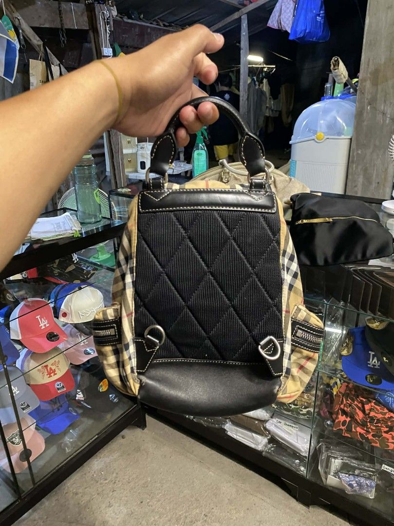 Burberry The Small Crossbody Rucksack (Category: Luxury Bags & Wallets) located in Polomolok. Submitted by warmfire.3185dd (Listing ID 1437544210, Image 3). Description: - Authentic Burberry backpack - Vintage check pattern - Drawstring closure - Two exterior zip pockets - missing Adjustable shoulder straps - Top handle - Interior branded leather tag - 'Made in Italy' - Durable material.