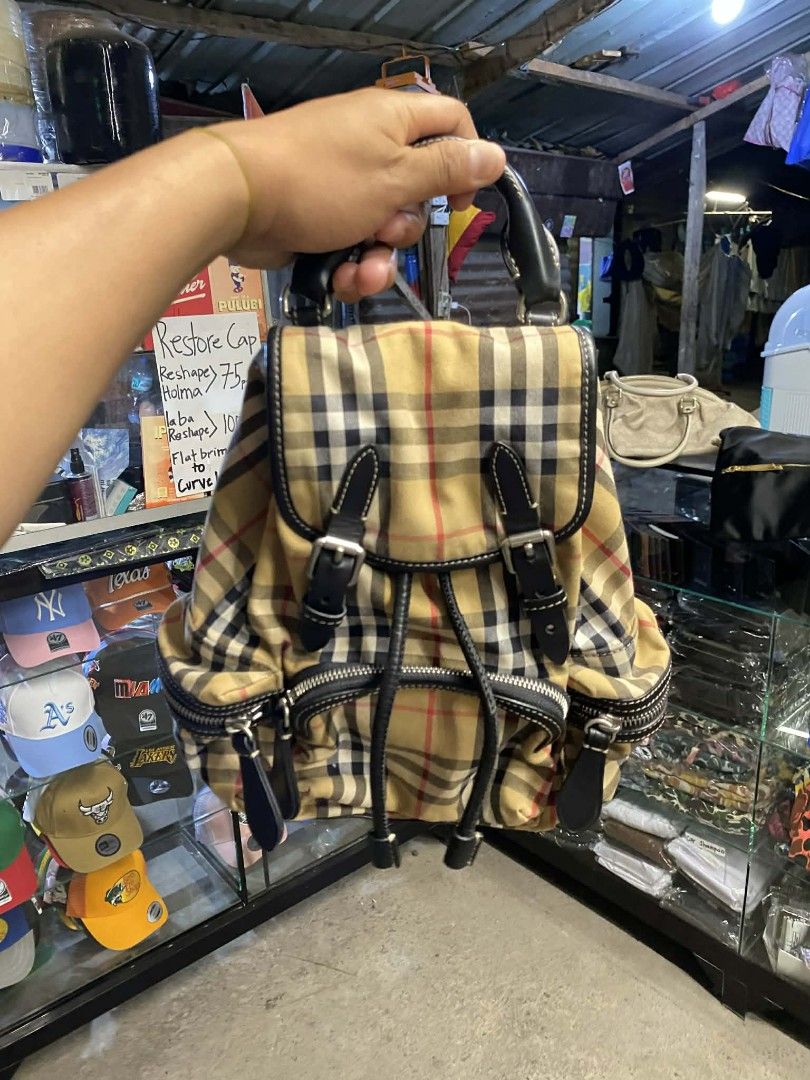 Burberry The Small Crossbody Rucksack (Category: Luxury Bags & Wallets) located in Polomolok. Submitted by warmfire.3185dd (Listing ID 1437544210, Image 2). Description: - Authentic Burberry backpack - Vintage check pattern - Drawstring closure - Two exterior zip pockets - missing Adjustable shoulder straps - Top handle - Interior branded leather tag - 'Made in Italy' - Durable material.