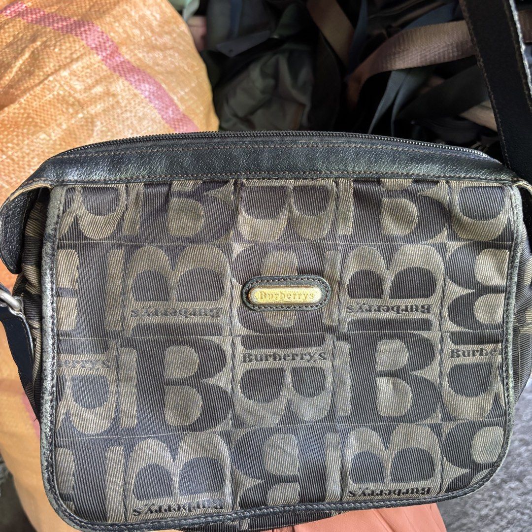 Burberrys London Shoulder Bag (Category: Luxury Bags & Wallets) located in Banga. Submitted by akosiloco (Listing ID 1437482364, Image 2). Description: - Authentic Burberrys London shoulder bag - Classic monogram pattern - Leather strap - Gold-tone buckle - Interior pocket - "Burberrys London Made in Italy" interior tag.