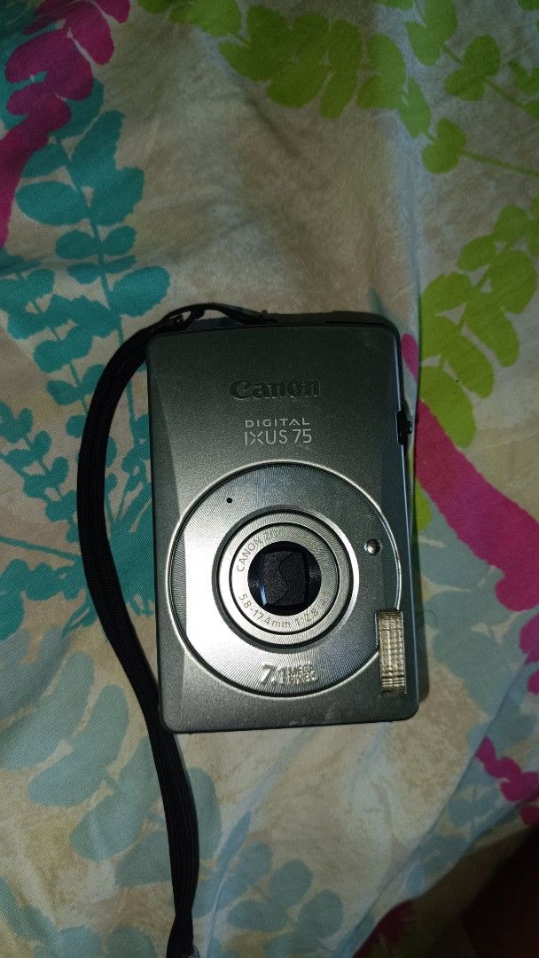 Canon Digital IXUS 75 Camera (Category: Cameras) located in Taguig. Submitted by redarmy21775000 (Listing ID 1437407398, Image 3). Description: - Canon Digital IXUS 75 camera - Silver color - 7.1 MP lens - Includes black Canon case - Comes with wrist strap - Screen has some scratches - no battery - with sd card 2gb - not sure if working.