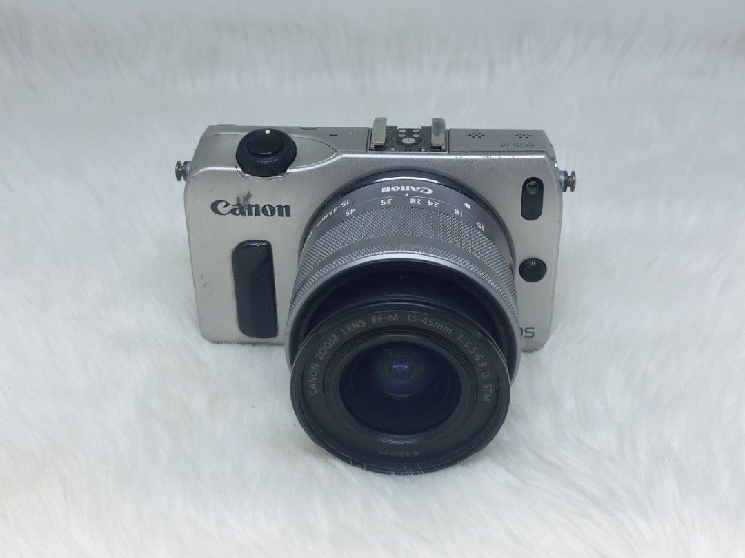 Canon EOS M Camera with Lens(defective) (Category: Cameras) located in Manila. Submitted by jonrick.co (Listing ID 1437524305, Image 1). Description: - Canon EOS M camera - Includes Canon Zoom Lens EF-M 14-45mm 1:3.5-6.3 IS STM - Silver body - Built-in flash Selling as is defective for parts out or repair with power good lcd di mapindot keypad no focus no battery included borrow batt to test it sa interesado lang no to lowballer.