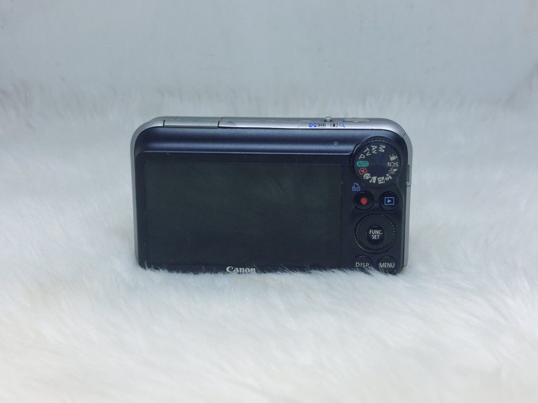Canon PowerShot SX210 IS (defective) (Category: Cameras) located in Manila. Submitted by jonrick.co (Listing ID 1437523543, Image 2). Description: - Canon PowerShot SX210 IS digital camera - 14x digital zoom lens - Sleek black body with silver trim - Features a display screen - Includes various function buttons - Canon logo visible defective no power for display or parts out or repair selling as is no return no exchange.