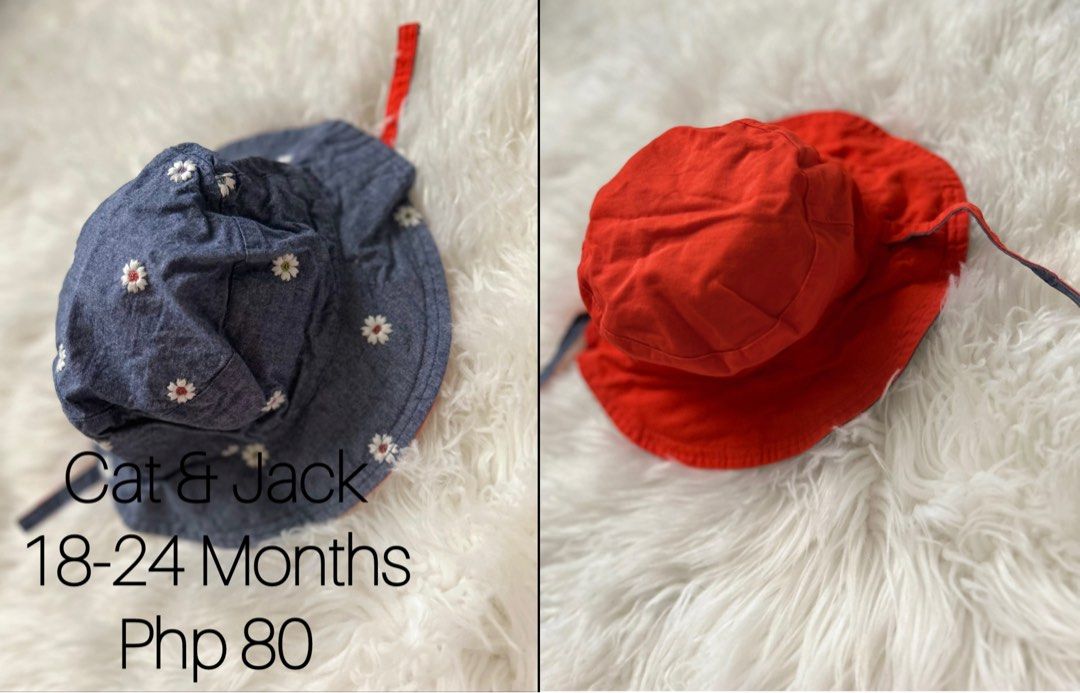Cat & Jack Reversible Baby Hat 18-24 Months (Category: Babies & Kids Fashion) located in Mabalacat. Submitted by pamroxas16 (Listing ID 1437581047, Image 1). Description: - Cat & Jack reversible baby hat - Denim blue side with daisy embroidery - Bright red side - Includes chin ties for a secure fit - Fits babies 18-24 months old - Provides sun protection and stylish look.