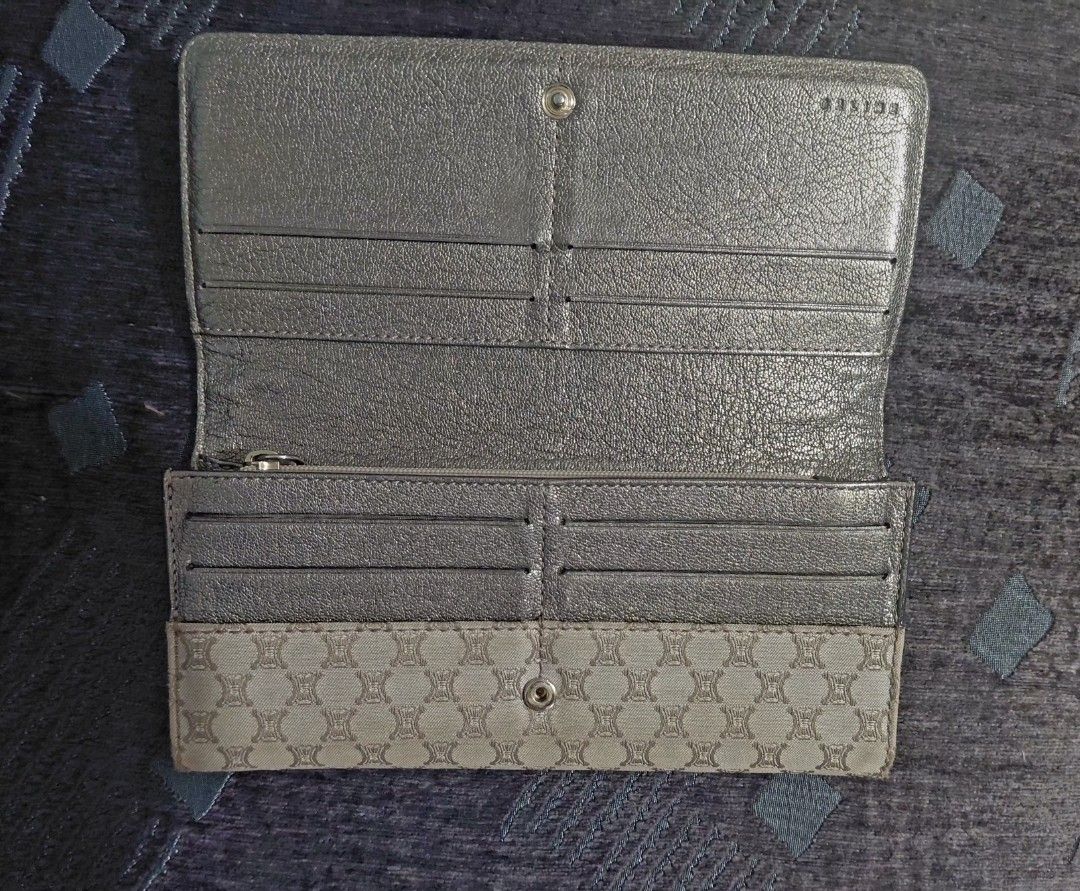Celine Long Wallet (Category: Luxury Bags & Wallets) located in Manila. Submitted by golflheng05384 (Listing ID 1437517034, Image 2). Description: - Authentic Celine long wallet - Beige monogram exterior - Includes original box, dust bag, and authenticity card - Multiple card slots - Zippered coin compartment - Snap closure.