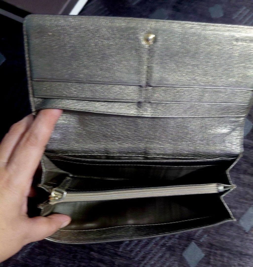 Celine Long Wallet (Category: Luxury Bags & Wallets) located in Manila. Submitted by golflheng05384 (Listing ID 1437517034, Image 3). Description: - Authentic Celine long wallet - Beige monogram exterior - Includes original box, dust bag, and authenticity card - Multiple card slots - Zippered coin compartment - Snap closure.