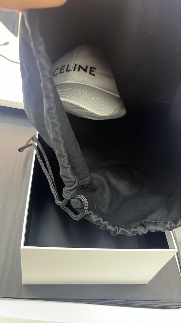 Celine White Cap (Category: Hats & Beanies) located in Taytay. Submitted by becha1 (Listing ID 1437431136, Image 3). Description: - Authentic Celine cap - Color: White - Embroidered Celine logo on front - Includes dust bag and box - Celine logo on interior lining - Unworn condition - Medium size.