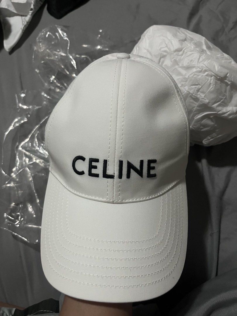 Celine White Cap (Category: Hats & Beanies) located in Taytay. Submitted by becha1 (Listing ID 1437431136, Image 1). Description: - Authentic Celine cap - Color: White - Embroidered Celine logo on front - Includes dust bag and box - Celine logo on interior lining - Unworn condition - Medium size.