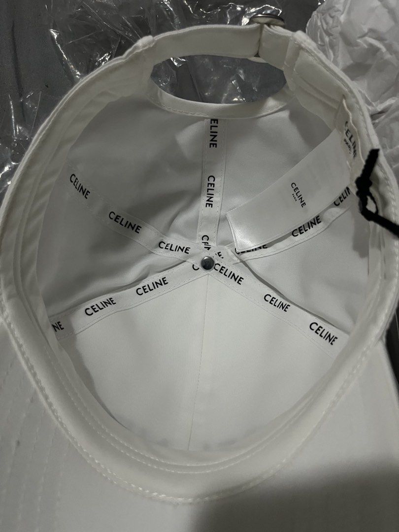 Celine White Cap (Category: Hats & Beanies) located in Taytay. Submitted by becha1 (Listing ID 1437431136, Image 2). Description: - Authentic Celine cap - Color: White - Embroidered Celine logo on front - Includes dust bag and box - Celine logo on interior lining - Unworn condition - Medium size.