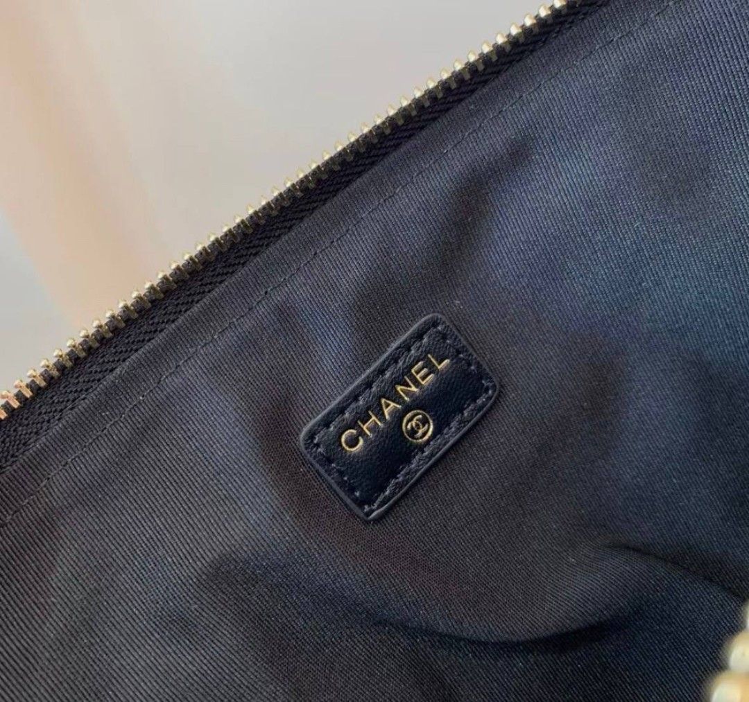 Chanel Quilted Wallet with Camellia Charm (Category: Luxury Bags & Wallets) located in Manila. Submitted by rani143 (Listing ID 1437455870, Image 2). Description: - 💯 Authentic Chanel Novelty Item -Gift with purchase item - Black quilted design - Gold-tone CC logo - Features camellia flower detail - Zip closure - Black interior with Chanel logo - Comes with original box - Sleek and sophisticated - Can fit big phones 💰 SRP: 3,200-3,500 6pcs avai