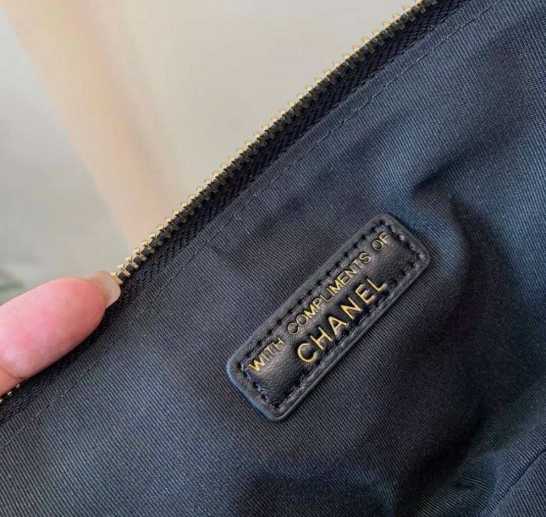 Chanel Quilted Wallet with Camellia Charm (Category: Luxury Bags & Wallets) located in Manila. Submitted by rani143 (Listing ID 1437455870, Image 3). Description: - 💯 Authentic Chanel Novelty Item -Gift with purchase item - Black quilted design - Gold-tone CC logo - Features camellia flower detail - Zip closure - Black interior with Chanel logo - Comes with original box - Sleek and sophisticated - Can fit big phones 💰 SRP: 3,200-3,500 6pcs avai