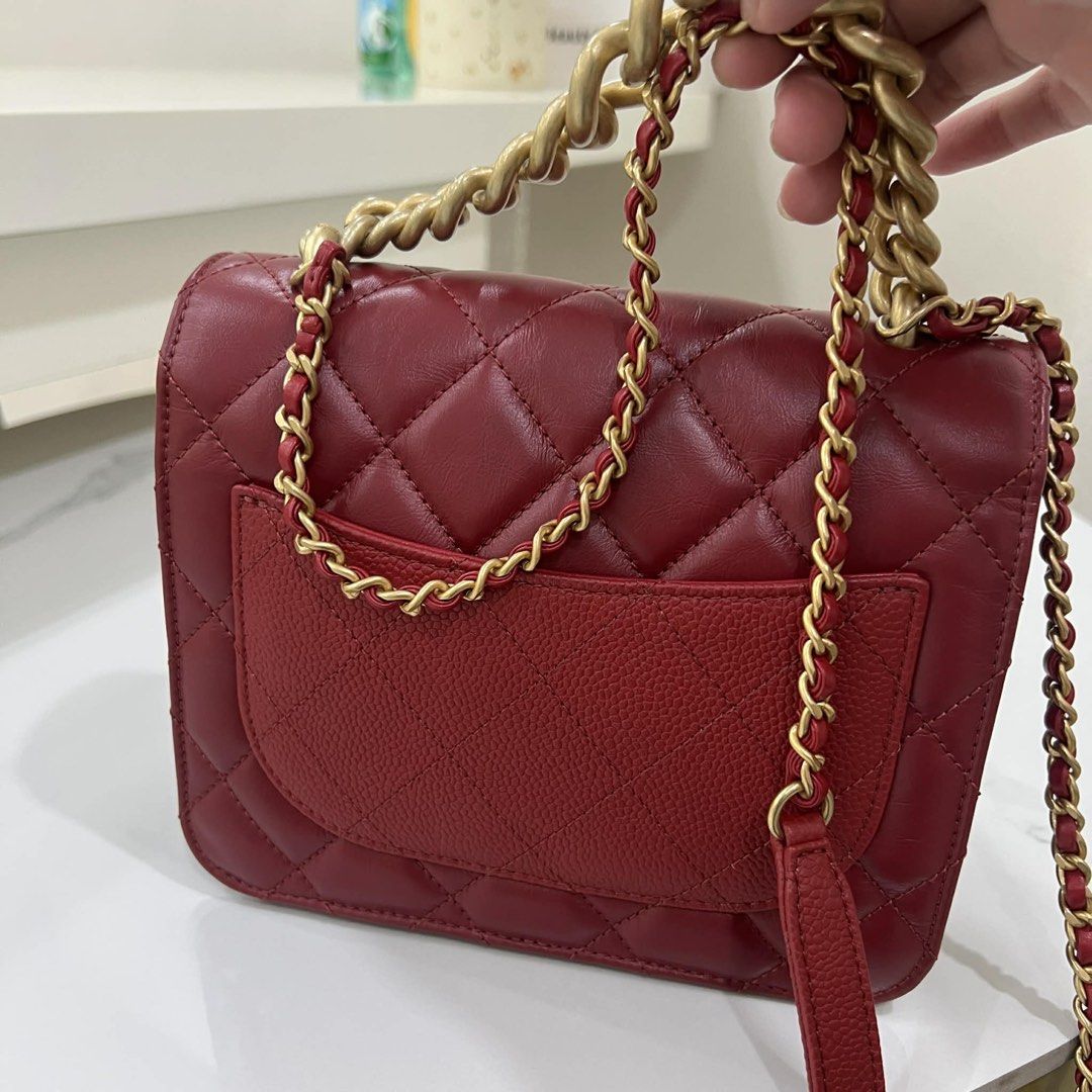 Chanel Red Quilted Shoulder Bag (Category: Luxury Bags & Wallets) located in Pasay City. Submitted by l0vingrstore (Listing ID 1437435564, Image 2). Description: GOOD AS NEW COMPLETE - Authentic Chanel shoulder bag - Quilted design - Gold chain strap - Flap closure with Chanel logo - Red color - Textured bottom - Multiple interior compartments - Includes dust bag.