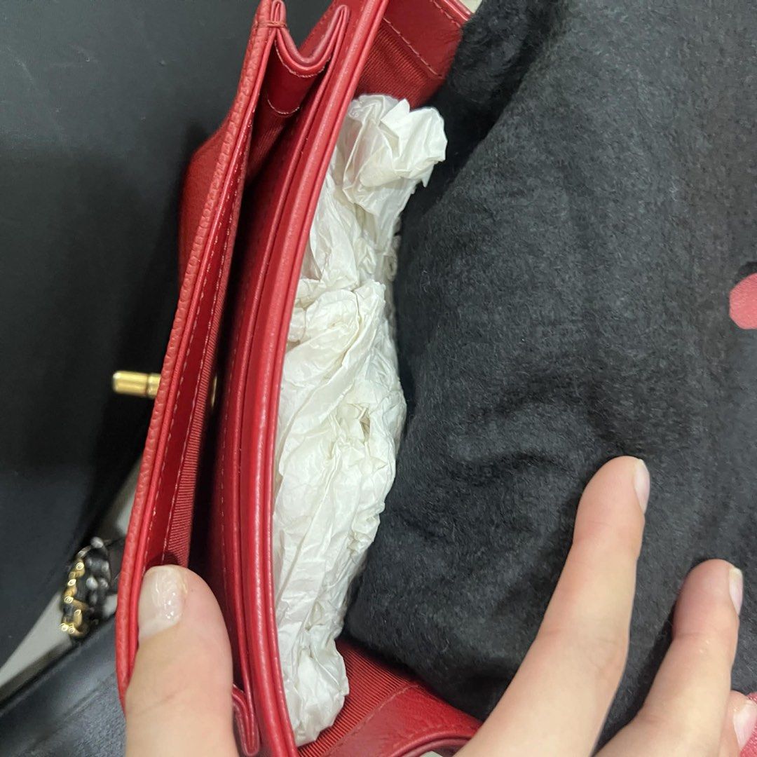 Chanel Red Quilted Shoulder Bag (Category: Luxury Bags & Wallets) located in Pasay City. Submitted by l0vingrstore (Listing ID 1437435564, Image 3). Description: GOOD AS NEW COMPLETE - Authentic Chanel shoulder bag - Quilted design - Gold chain strap - Flap closure with Chanel logo - Red color - Textured bottom - Multiple interior compartments - Includes dust bag.