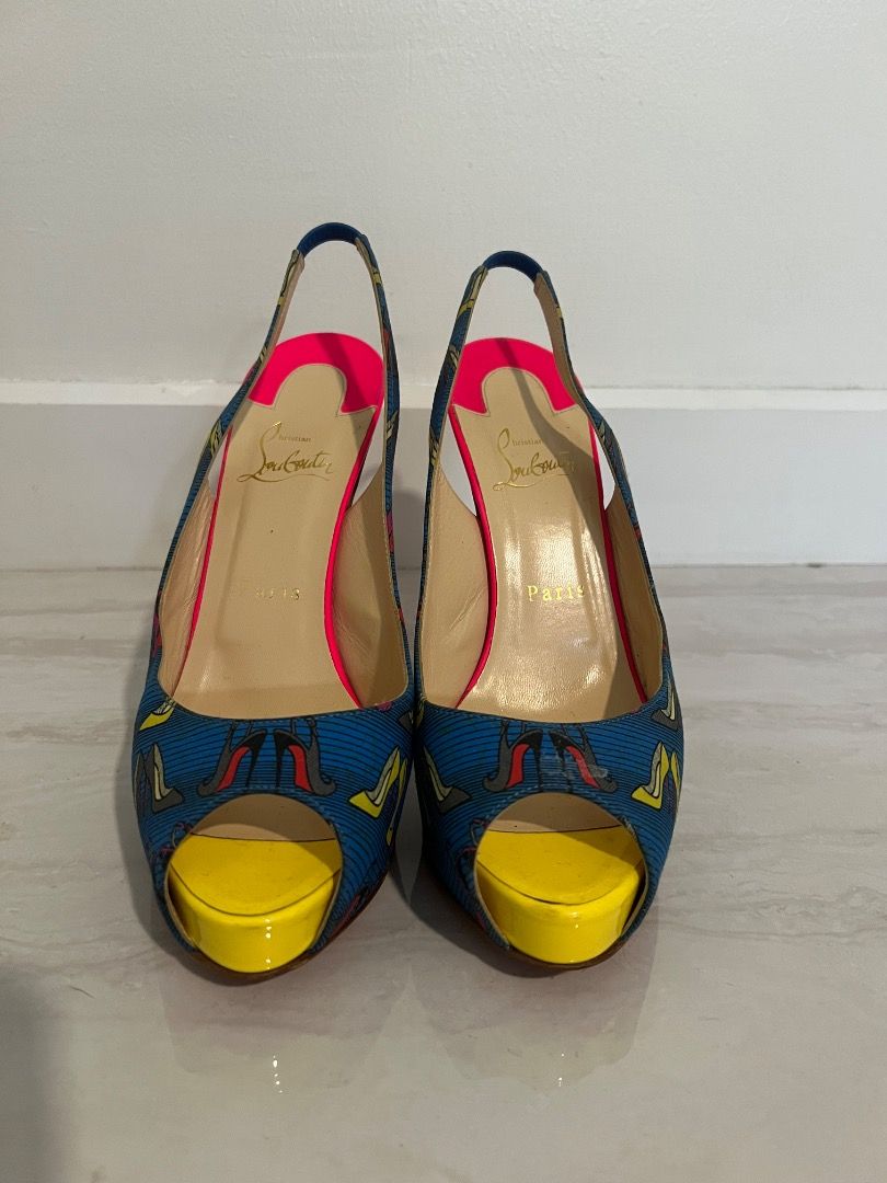 Christian Louboutin Slingback Heels (Category: Heels) located in Caloocan City. Submitted by kkrznrb (Listing ID 1437412567, Image 1). Description: - Vintage Christian Louboutin slingback heels - Vibrant blue patterned fabric upper - Bright pink heel and lining - Yellow toe box - Iconic red sole - Slingback strap for secure fit.
