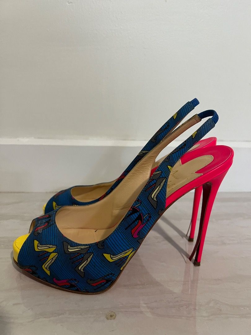 Christian Louboutin Slingback Heels (Category: Heels) located in Caloocan City. Submitted by kkrznrb (Listing ID 1437412567, Image 3). Description: - Vintage Christian Louboutin slingback heels - Vibrant blue patterned fabric upper - Bright pink heel and lining - Yellow toe box - Iconic red sole - Slingback strap for secure fit.