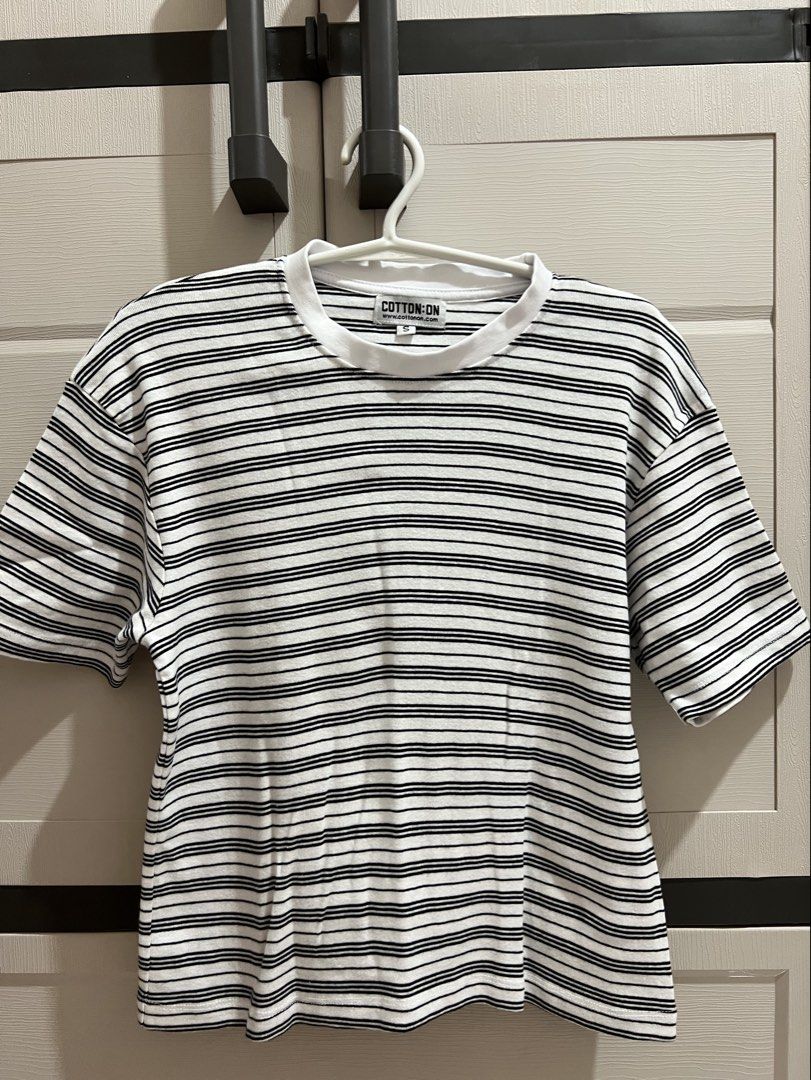 Cotton On Striped T-shirt (Category: Shirts) located in Bustos. Submitted by amcsantos_ (Listing ID 1437551792, Image 1). Description: - Size: Small-Medium - Fabric: Cotton - Black and White Striped.