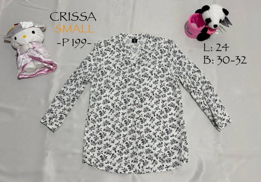 Crissa Floral Blouse - Small (Category: Blouses) located in Alaminos. Submitted by declutteritems2024 (Listing ID 1437559171, Image 1). Description: - Crissa floral blouse - Size: Small - Design: V-neck, long sleeves - Color: White base with black floral pattern - Measurements: - Length: 24 inches - Bust: 30-32 inches - Perfect for casual wear.