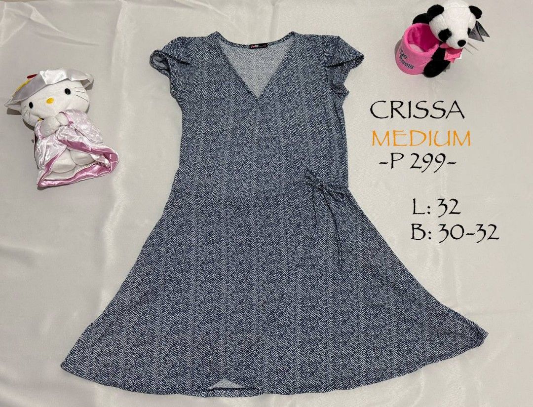 Crissa Medium Dress (Category: Dresses) located in Alaminos. Submitted by declutteritems2024 (Listing ID 1437559675, Image 1). Description: Crissa dress in size Medium. Features a V-neck design and short sleeves. The dress has a tie detail on the side. Length is 32 inches and bust is 30-32 inches. The dress has a patterned design. Perfect for casual wear..
