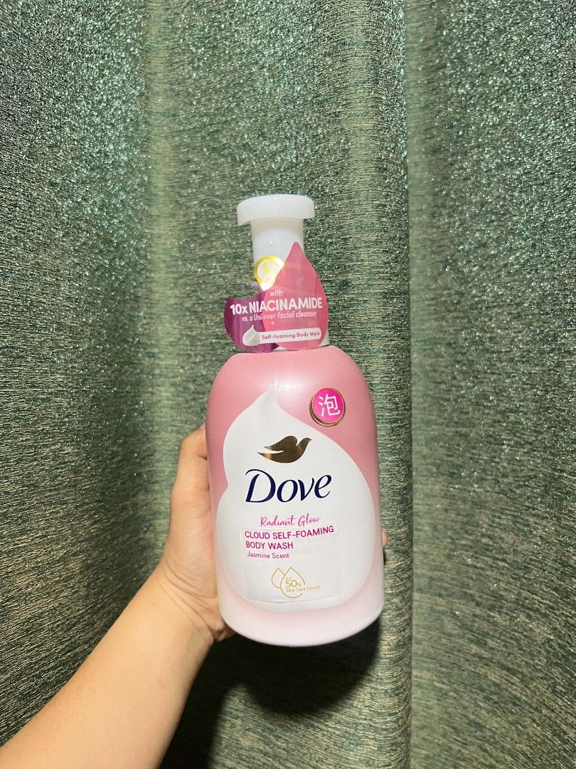 Dove Radiant Glow Cloud Self-Foaming Body Wash (Category: Bath) located in Manila. Submitted by swiftlion-552a (Listing ID 1437529183, Image 1). Description: - Dove Radiant Glow Cloud Self-Foaming Body Wash - Infused with 10x Niacinamide - Features a pink and white bottle design - Self-foaming formula - Production date: 202805 (Unilever) - Unilever product.