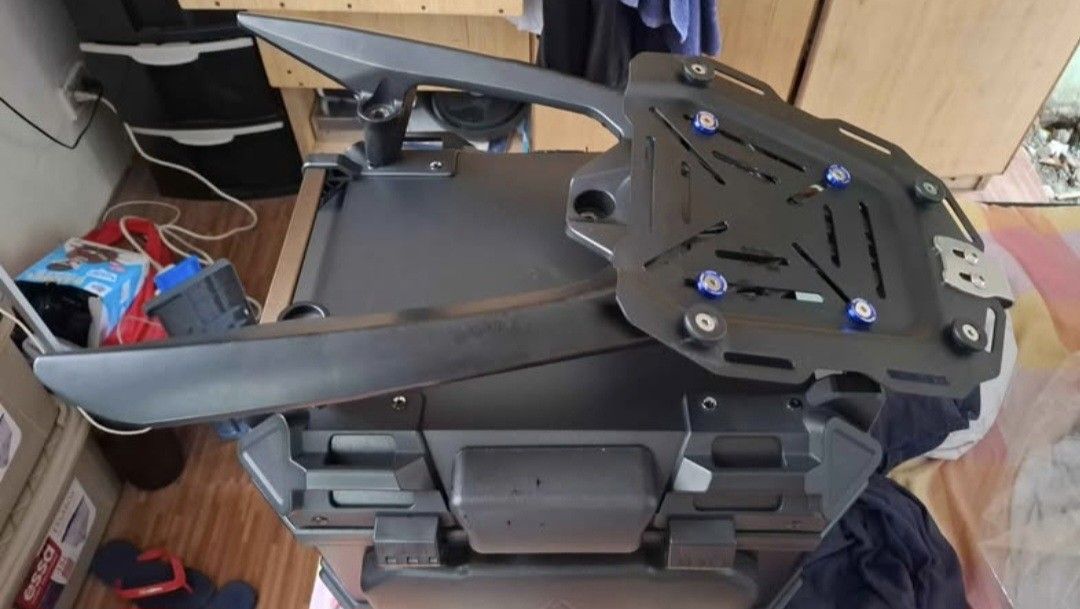 Duhan Top Box with (Category: Other Motorcycles Parts and Accessories) located in Taguig. Submitted by cessyago123 (Listing ID 1437445837, Image 2). Description: - Durable duhan motorcycle top box - Secure locking mechanism - Stylish black exterior - Padded interior - Includes mounting plate for easy installation - Comes with keys for added security - Perfect for helmets and luggage - Sleek design, ready to mount.
