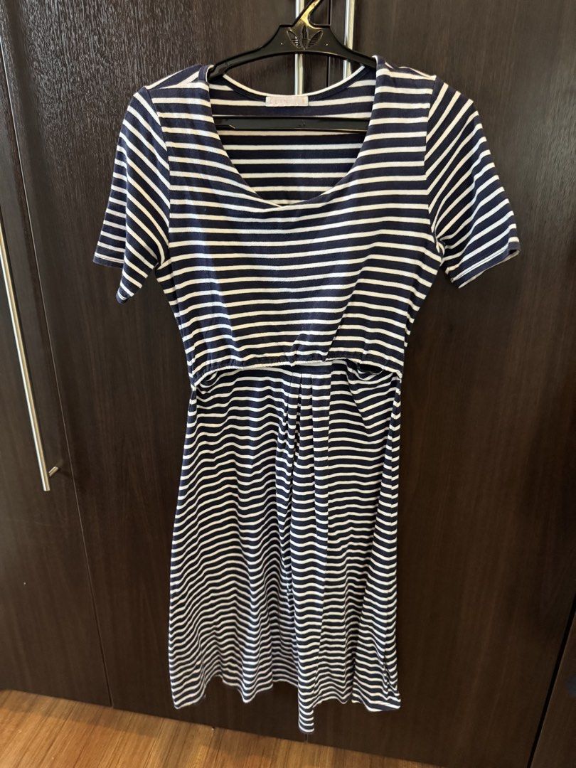 Elin Cecilia nursing/pumping dress (Category: Dresses) located in Bacoor. Submitted by mlgon1 (Listing ID 1437473886, Image 1). Description: - Navy and white striped nursing dress - Scoop neckline - Short sleeves - Fitted bodice with flared skirt - Discreet nursing access - Comfortable, breathable fabric - Perfect for breastfeeding mothers.