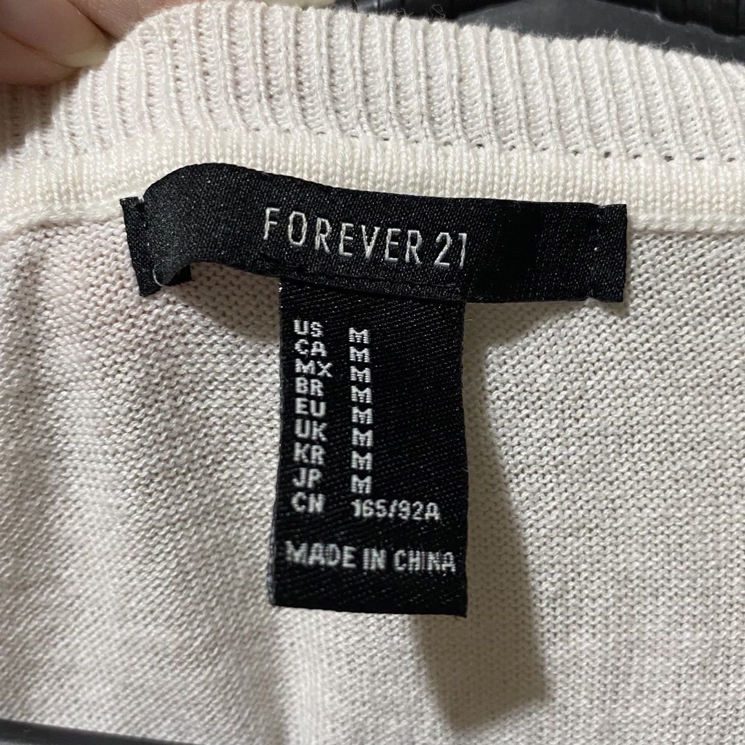 Forever 21 3/4 Light Pink Cardigan (Category: Longsleeves) located in Cavite. Submitted by star444ngel (Listing ID 1437449995, Image 3). Description: Medium, but leaning towards Small This is pinkish! Super light tint of pink .