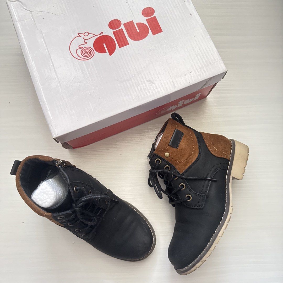 Gibi Black and Tan Boots Size 30 (Category: Babies & Kids Fashion) located in Cavite. Submitted by gccwardrobe (Listing ID 1437443691, Image 1). Description: Gibi boots in black and tan color. Size 30. Features a lace-up design with a side zipper. The boots come with their original box. The box indicates the model number is BT-CB029 and the original price was 1899 pesos..
