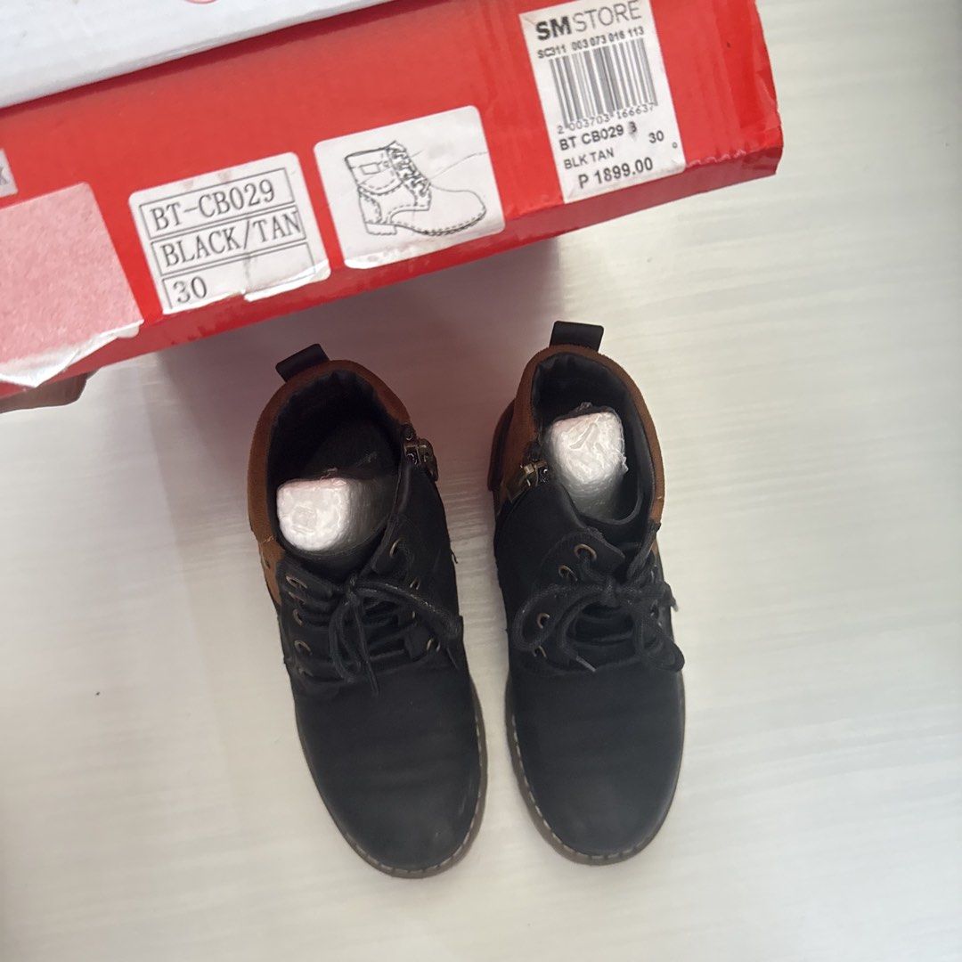 Gibi Black and Tan Boots Size 30 (Category: Babies & Kids Fashion) located in Cavite. Submitted by gccwardrobe (Listing ID 1437443691, Image 2). Description: Gibi boots in black and tan color. Size 30. Features a lace-up design with a side zipper. The boots come with their original box. The box indicates the model number is BT-CB029 and the original price was 1899 pesos..