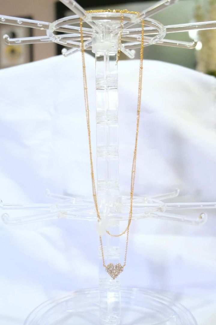 Gold Heart Pendant Necklace (Category: Necklaces) located in Tarlac. Submitted by alleiz1521 (Listing ID 1437410831, Image 1). Description: - Gold double-layered chain necklace - Features a heart-shaped pendant - Adorned with sparkling crystals - Simple and sophisticated design - Suitable for casual and formal wear.