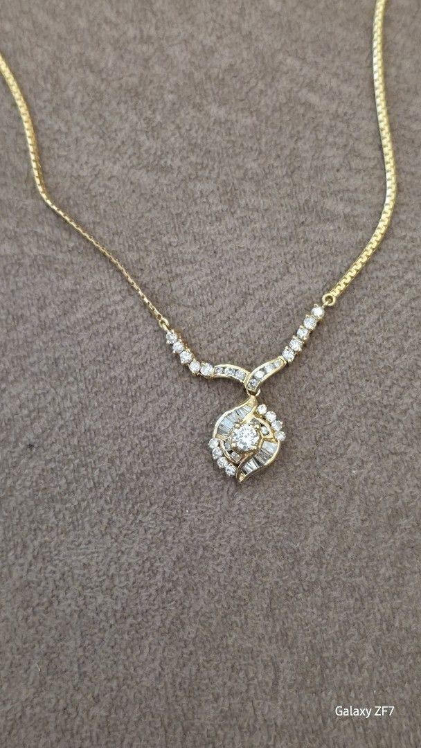 Gold Necklace with Diamond Pendant (Category: Necklaces) located in Puerto Princesa. Submitted by mhavih_28 (Listing ID 1437424440, Image 1). Description: - Gold necklace with a delicate chain. - Features a sparkling diamond pendant. - Pendant adorned with multiple small diamonds. - Classic design, versatile for any occasion..