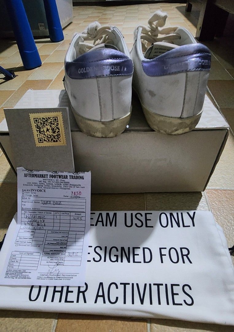 Golden Goose Superstar Sneakers (Category: Sneakers) located in Antipolo. Submitted by roshc (Listing ID 1437528284, Image 3). Description: - Golden Goose Superstar sneakers - White leather upper - Navy star detail - Distressed, pre-loved look - Includes original box - Includes dust bag - Includes sales invoice.
