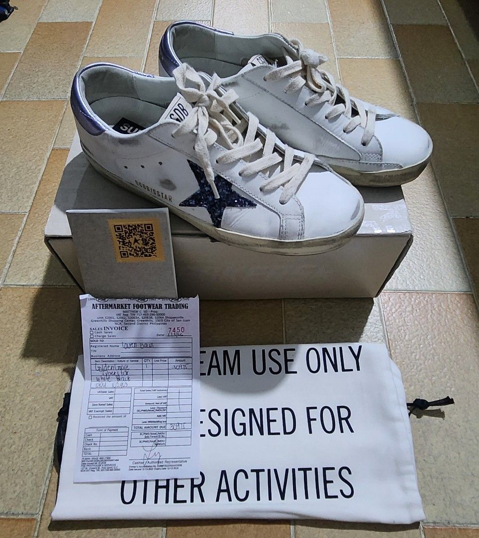 Golden Goose Superstar Sneakers (Category: Sneakers) located in Antipolo. Submitted by roshc (Listing ID 1437528284, Image 2). Description: - Golden Goose Superstar sneakers - White leather upper - Navy star detail - Distressed, pre-loved look - Includes original box - Includes dust bag - Includes sales invoice.