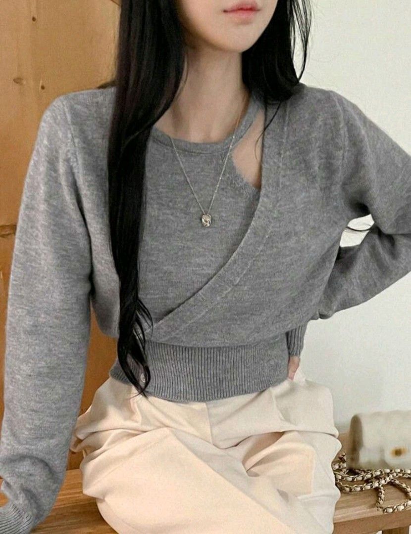 Gray Cutout Sweater (Category: Longsleeves) located in Taguig. Submitted by chicstyle (Listing ID 1434029391, Image 2). Description: - Gray sweater - Cutout neckline - Wrap-style design - Long sleeves - Ribbed hem - Button closure - Soft knit material.