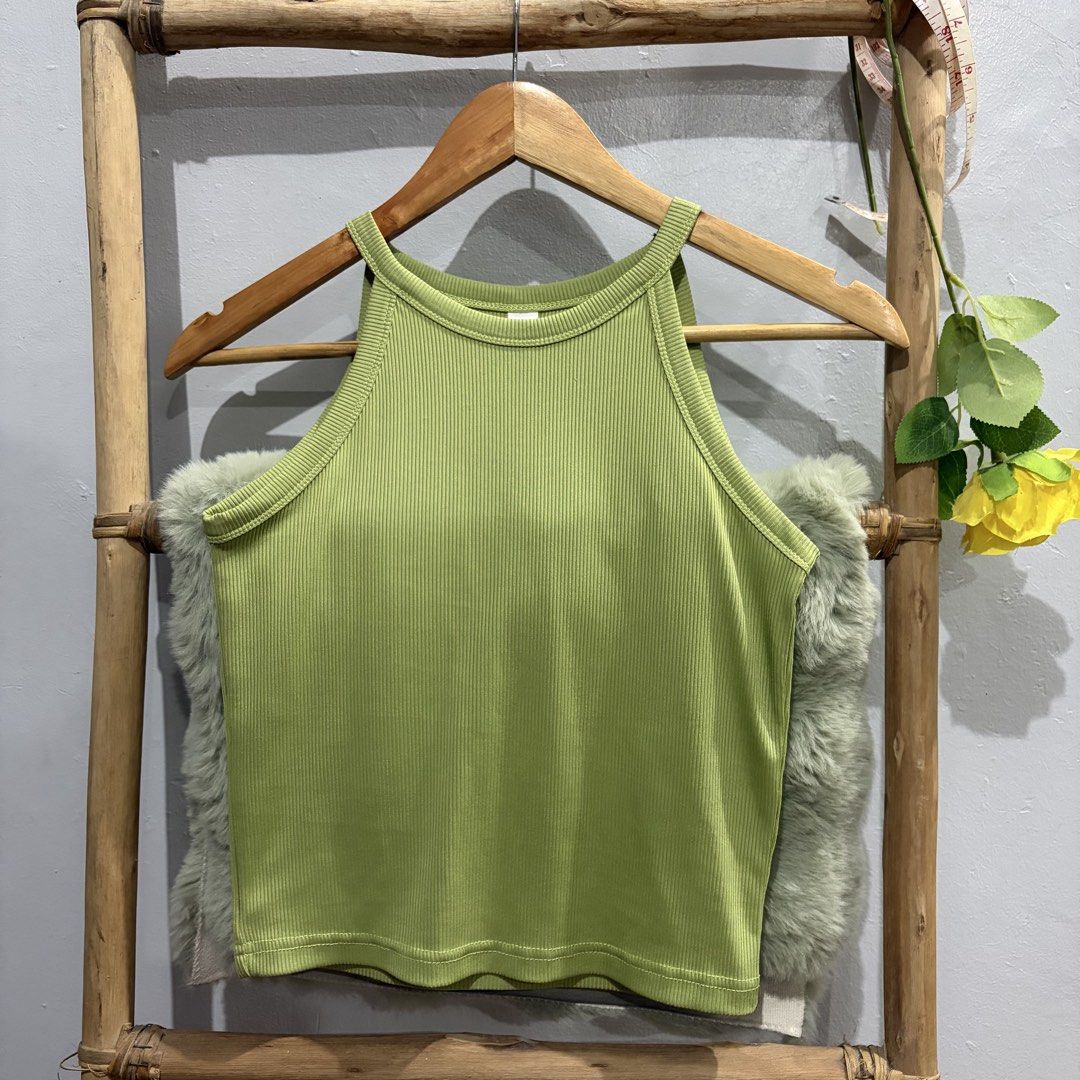 Green Ribbed Tank Top (Category: Sleeveless) located in Pateros City. Submitted by lovealy_07 (Listing ID 1437533053, Image 1). Description: - Green tank top - Ribbed texture - Halter neckline - Size: Small - Solid green color - Versatile for casual wear.