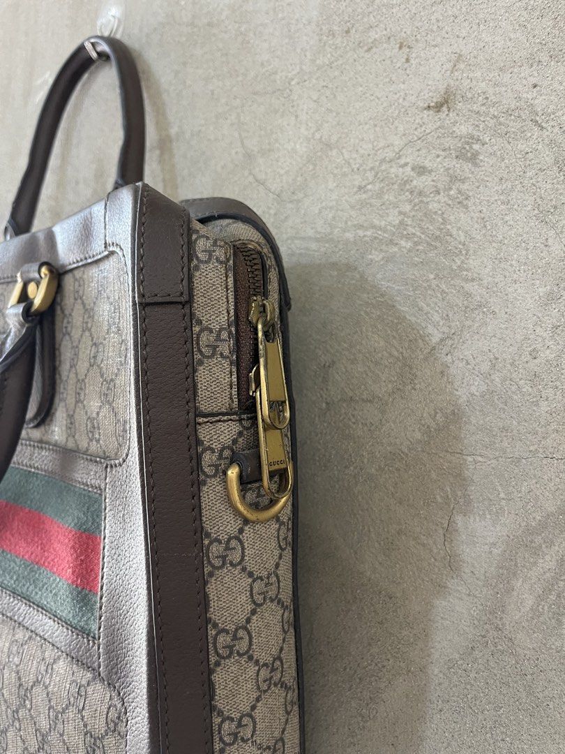 GUCCI GG motif briefcase (Category: Luxury Bags & Wallets) located in Cagayan de Oro. Submitted by vintagevvvictim (Listing ID 1437432784, Image 3). Description: Very good used condition interior needs cleaning some scratches on the fabric sherry line .