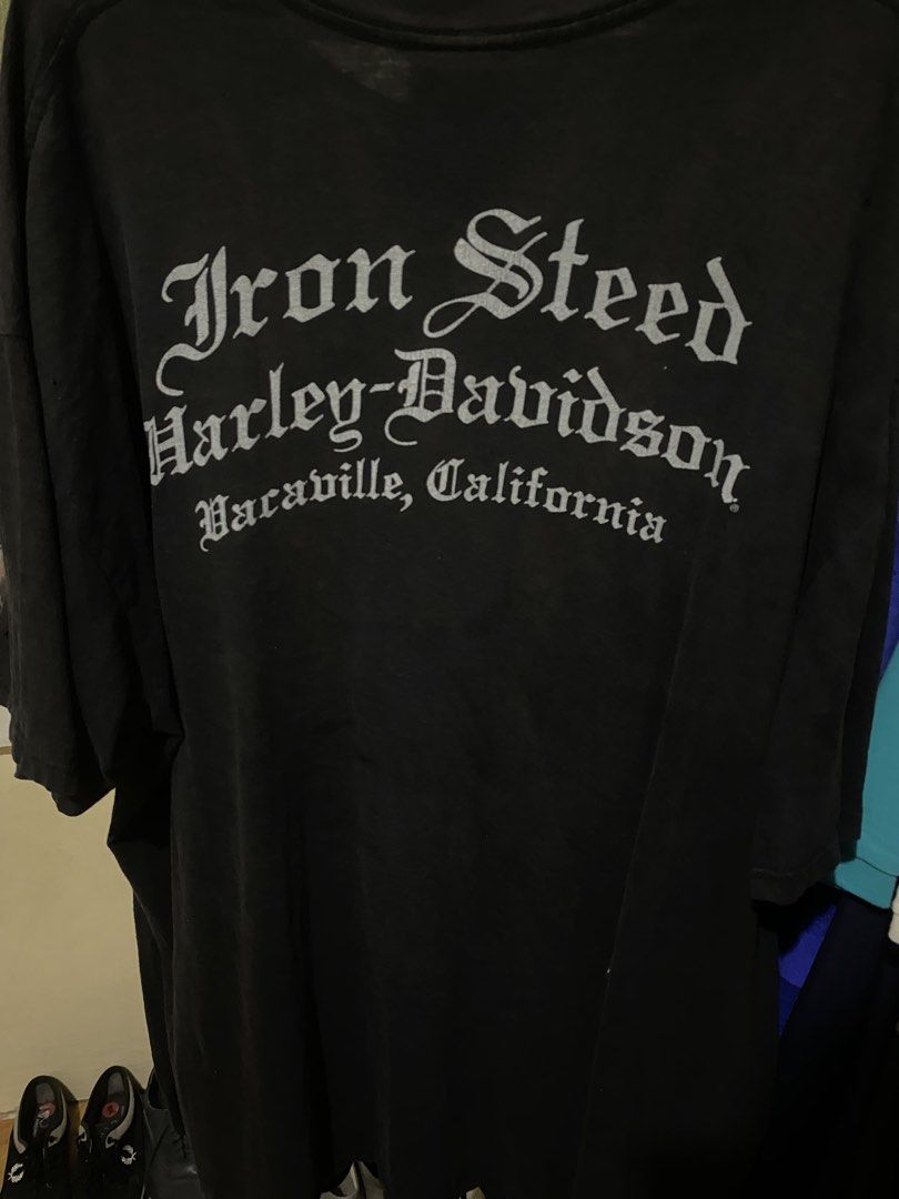 Harley-Davidson Iron Steed Skull Graphic Tee (Category: Tshirts & Polo Shirts ) located in Numancia. Submitted by jaeysciee (Listing ID 1437566504, Image 2). Description: - Vintage Harley-Davidson t-shirt - Features a skull graphic with wings on the front - Back print: "Iron Steed Harley-Davidson Vacaville, California" in gothic font - Classic crew neck - Short sleeves.