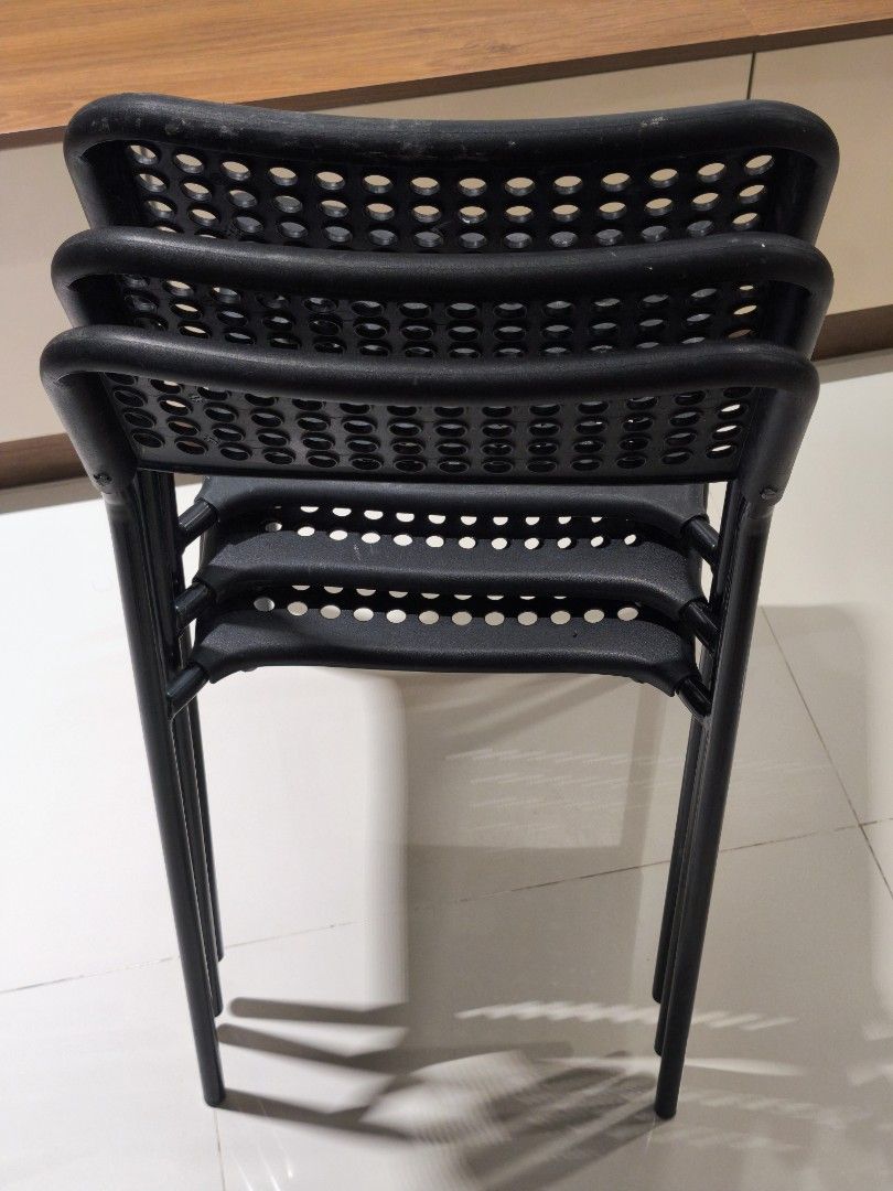 IKEA Adde Stackable Chairs (Category: Chairs) located in Kuala Lumpur. Submitted by kapalterbang_737 (Listing ID 1437523385, Image 3). Description: - IKEA Adde chair for sale - Black stackable chairs - Perforated seat and backrest - Durable plastic or similar material - Sturdy metal legs - Space-saving design: stackable for easy storage RM50 for 3units.
