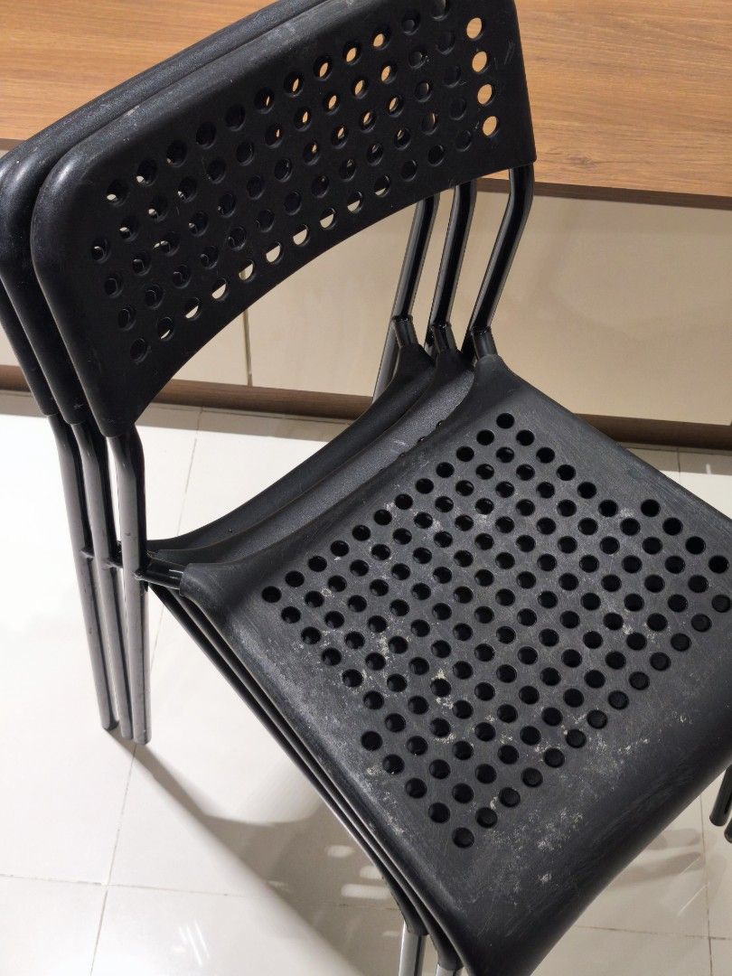 IKEA Adde Stackable Chairs (Category: Chairs) located in Kuala Lumpur. Submitted by kapalterbang_737 (Listing ID 1437523385, Image 2). Description: - IKEA Adde chair for sale - Black stackable chairs - Perforated seat and backrest - Durable plastic or similar material - Sturdy metal legs - Space-saving design: stackable for easy storage RM50 for 3units.