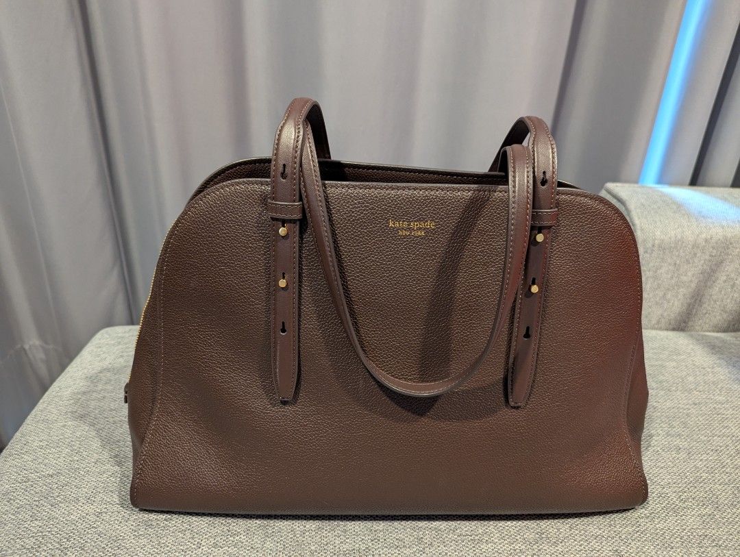 Kate Spade Maise Carryall Bag (Category: Tote Bags) located in Quezon City. Submitted by vert1cal (Listing ID 1437418612, Image 2). Description: Interior center zip compartment, two side compartments, two slip pockets Zip closure Fits iphone max, zip around continental wallet, ipad & 15" laptop Material: Pebbled leather and suede Dimensions: L 41.4cm x H 27cm x W 14cm Includes dust bag, care card, and shopping bag.