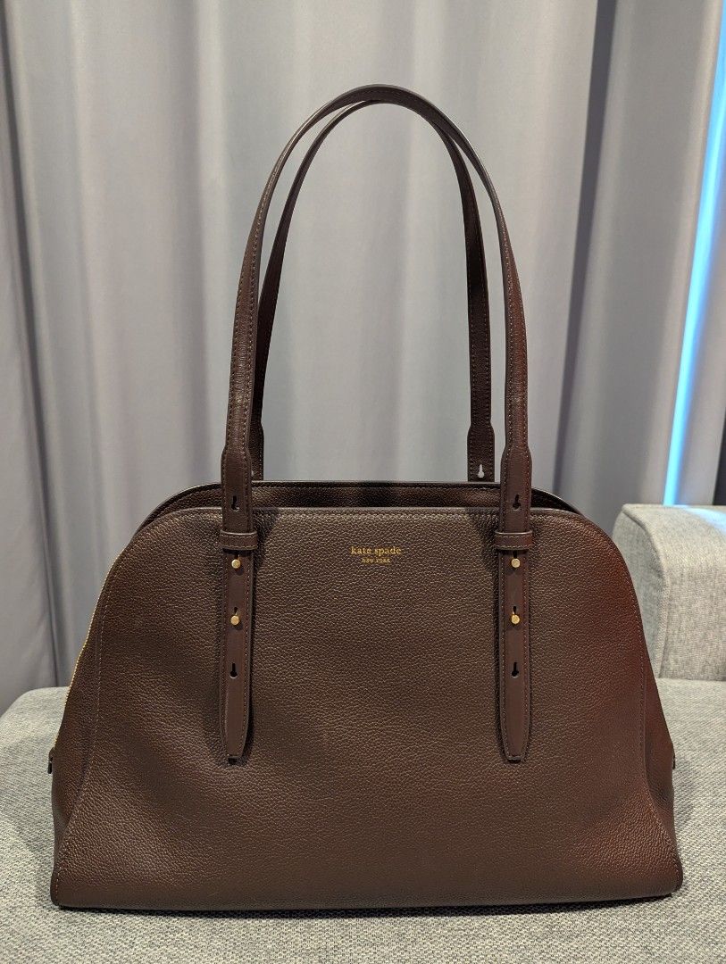 Kate Spade Maise Carryall Bag (Category: Tote Bags) located in Quezon City. Submitted by vert1cal (Listing ID 1437418612, Image 1). Description: Interior center zip compartment, two side compartments, two slip pockets Zip closure Fits iphone max, zip around continental wallet, ipad & 15" laptop Material: Pebbled leather and suede Dimensions: L 41.4cm x H 27cm x W 14cm Includes dust bag, care card, and shopping bag.