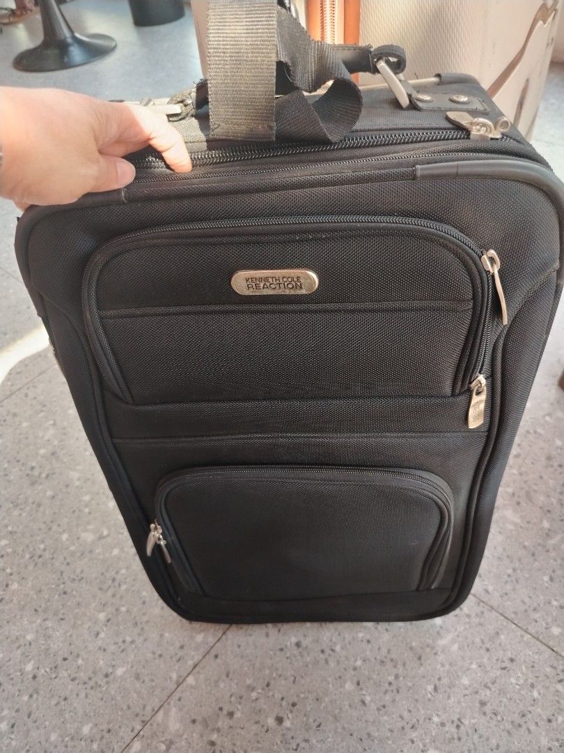 Kenneth Cole Reaction cabin Rolling Luggage (Category: Luggage) located in Manila. Submitted by purediamond888 (Listing ID 1437489685, Image 2). Description: Cabin luggage bag- Black Kenneth Cole Reaction rolling luggage - Multiple zippered compartments - Retractable handle and wheels for easy transport Fresh and good condition -unisex - Top handle and shoulder strap included.
