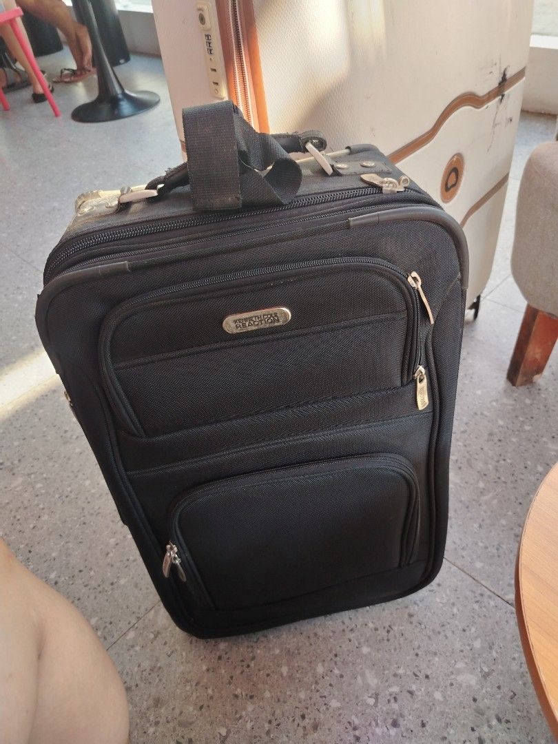 Kenneth Cole Reaction cabin Rolling Luggage (Category: Luggage) located in Manila. Submitted by purediamond888 (Listing ID 1437489685, Image 3). Description: Cabin luggage bag- Black Kenneth Cole Reaction rolling luggage - Multiple zippered compartments - Retractable handle and wheels for easy transport Fresh and good condition -unisex - Top handle and shoulder strap included.