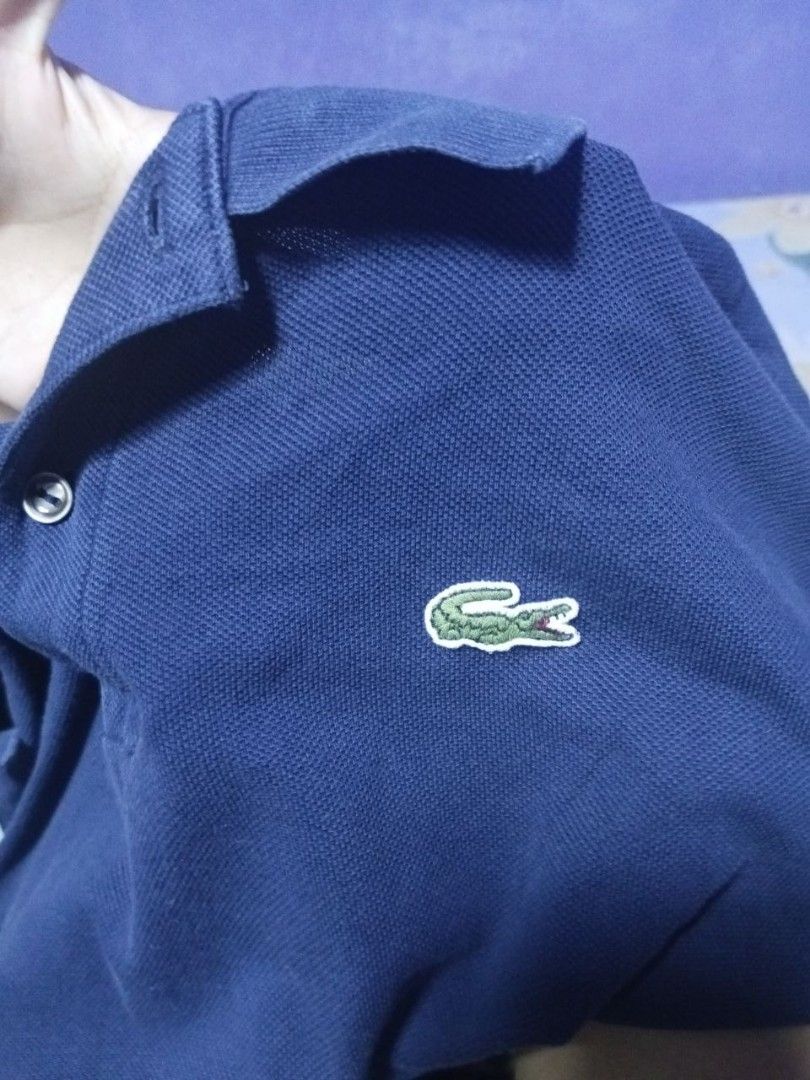 Lacoste Long Sleeve Polo Shirt (Category: Tshirts & Polo Shirts ) located in Manila. Submitted by quick.jerieme (Listing ID 1437567209, Image 1). Description: - Authentic Lacoste long sleeve polo shirt - Features the iconic crocodile logo - Made in France - Classic polo collar and buttoned placket - Size: 4 - Color: Deep navy blue.