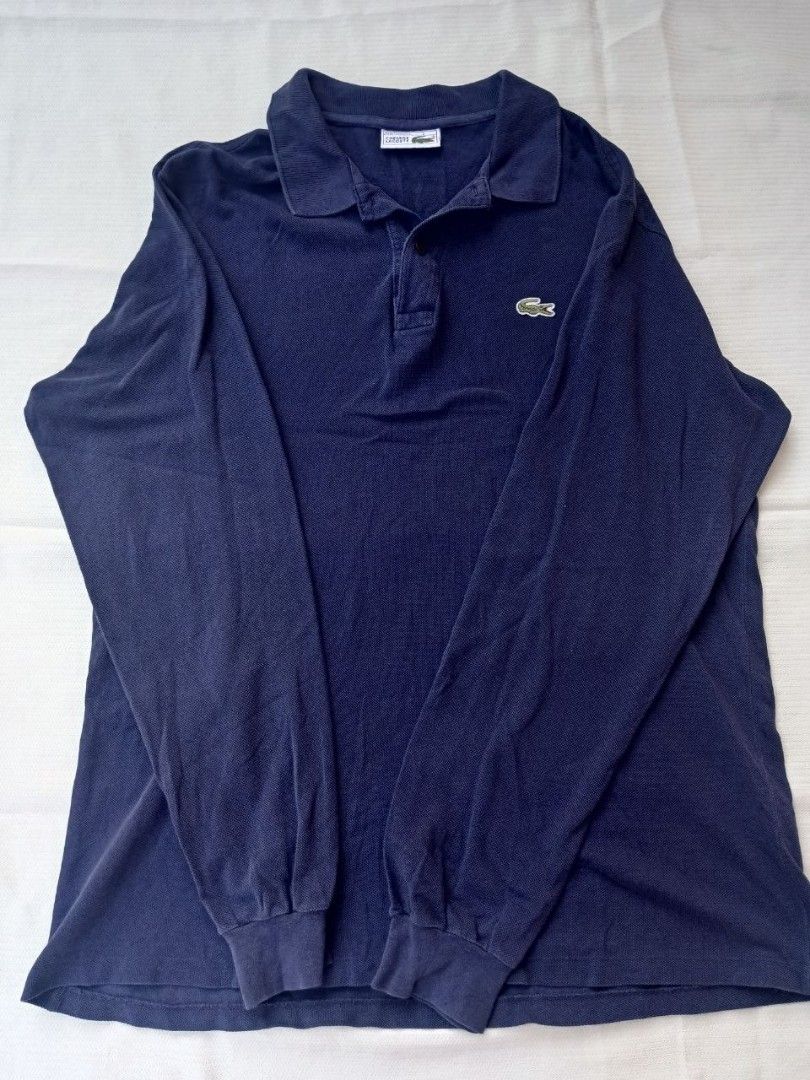 Lacoste Long Sleeve Polo Shirt (Category: Tshirts & Polo Shirts ) located in Manila. Submitted by quick.jerieme (Listing ID 1437567209, Image 2). Description: - Authentic Lacoste long sleeve polo shirt - Features the iconic crocodile logo - Made in France - Classic polo collar and buttoned placket - Size: 4 - Color: Deep navy blue.