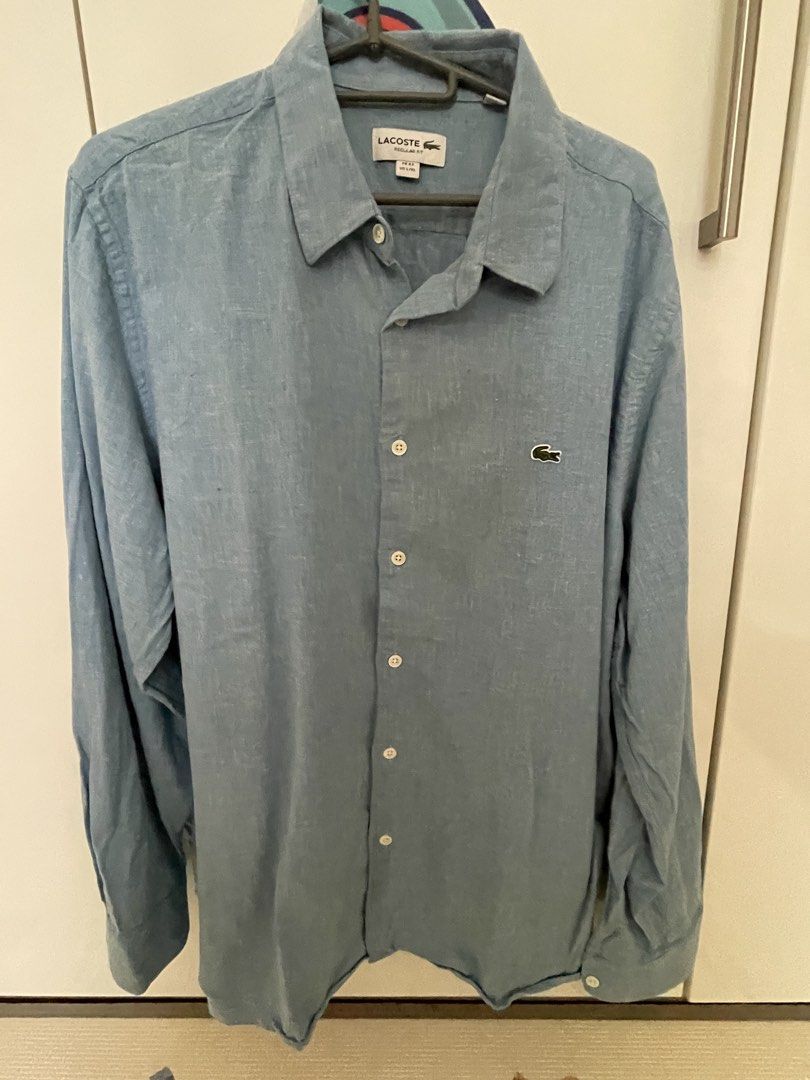 Lacoste Regular Fit Long Sleeve Shirt (Category: Tshirts & Polo Shirts ) located in Manila. Submitted by baymaxthegreat (Listing ID 1437418146, Image 1). Description: - Lacoste long sleeve shirt - Light blue color - Regular fit - Size: FR 43 / US L/XL - Iconic Lacoste logo on chest - Button-down closure - Classic collar - Lightweight fabric - Perfect for casual wear.